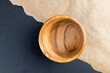 a wooden bowl on the table