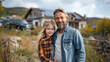 © aekkorn - Family with little girl standing in front of their house with solar panels on the roof, having electric car.