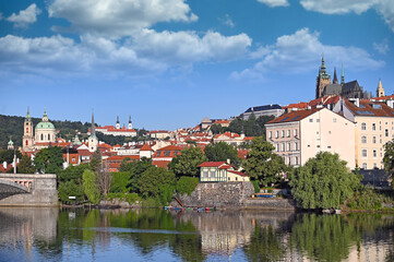 Canvas Print - View from the bank of the Vltava river to the Prague castle,churches and old town buildings