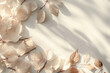 A minimal aesthetic background with autumn white leaves is used for the presentation of a wooden