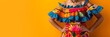 Traditional Mexican dress on orange background with copy space. Cinco De Mayo holiday, celebration. Mexican culture concept. Design for banner, poster 