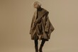 © Katsiaryna - A model wears an oversized wool blazer in taupe