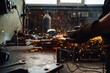 © Zamrznuti tonovi - Working in a metal workshop while grinding a big piece of metal plate.