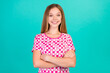 © deagreez - Photo portrait of lovely teen lady crossed hands confident toothy smile wear trendy print pink garment isolated on cyan color background