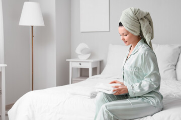 Canvas Print - Young woman with clean towel after shower in bedroom