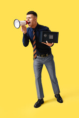 Sticker - Young man with safe box and megaphone screaming on yellow background