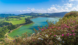 Fototapeta Góry - Gaze over the vibrant greens of Furnas Lake from Miradouro do Pico do Ferro, a stunning testament to São Miguel volcanic splendor and rich flora.