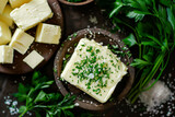 Fototapeta Góry - Closeup of garlic creamy butter with herbs and rosemary for sandwiches and steak as background