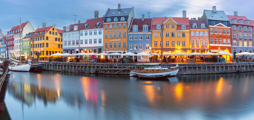 Wall Mural - Panorama of Nyhavn with colorful facades of old houses and ships in Old Town of Copenhagen, Denmark.