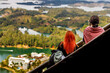 Two women take photos from the stairs of the Rock of Guatape in Antioquia, Colombia