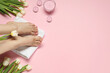 Closeup of woman with neat toenails after pedicure procedure on pink background, top view. Space for text