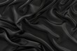Elegant top view of rich black satin folds, ideal for premium branding and luxe designs.