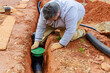 © ungvar - Laying underground drainage pipe system for outflow of rain stormwater