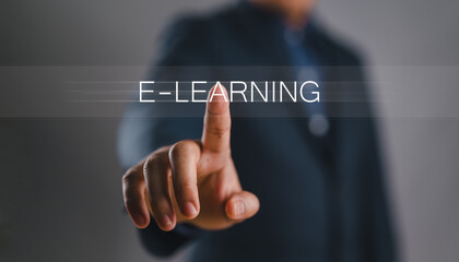 Leinwandbilder - Online education concept. Person touch virtual screen of E-learning word for online education training and e-learning webinar on internet. Increase business working skills