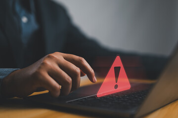 Poster - Businessman or it staffs, programmer, developer using computer laptop with triangle caution warning sign for notification error and maintenance concept. Hack system alert, warning computer system