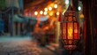 A lantern is lit in front of the house as a symbol of peace and prosperity