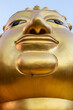 Head of Golden Buddha on white background