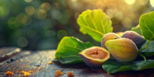 Close-up Of Ripe Sweet Yellow And Green Figs With Leaves On A Wooden Table.