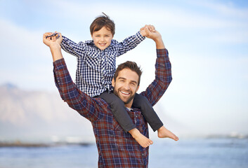 Wall Mural - Beach, portrait and happy man with child on shoulders, smile and mockup space on outdoor adventure. Support, face of father and son in nature for fun, bonding and trust on ocean holiday together