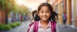 Happy smiling filipino little kid girl carrying a backpack going back to school looking at the camera, copy space banner template backdrop from Generative AI