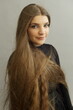 Beautiful teenage girl with extra long brown hair studio shot