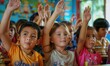 © Milan - Children at classroom with hands up.