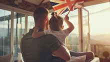 United Kingdom's Proud Family: Father And Daughter Hold Smiling Union Jack Flag

