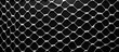 A close-up of a monochrome photograph of a mesh