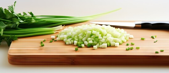 Poster - Chopped green onions on a cutting board with a knife