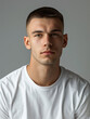© road to millionaire - A studio shot of a serious-looking young man with short hair, captured with a simplistic background to highlight his expression