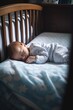 shot of a newborn sleeping peacefully in his crib