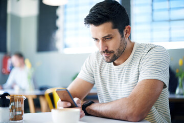 Man at restaurant, smartphone and scroll on social media, reading on mobile app or ebook with communication and contact. Chat, email or text message with tech, search internet and online at cafe