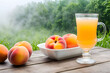 peach fruit with peach juice in the fog on a hot sunny day