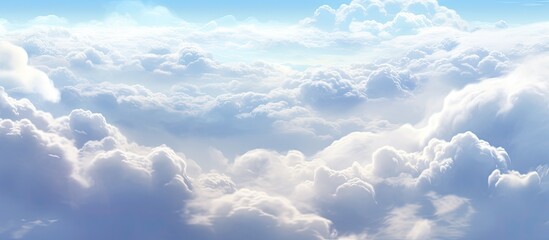 Wall Mural - An image showing a plane soaring through a sky filled with fluffy white clouds