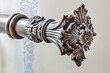 closeup of a decorative curtain rod with elaborate ends