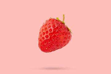 Wall Mural - Strawberry floated on pink background close up