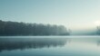 A serene lake enveloped in soft morning fog, with distant forested hills and the gentlest ripples on the water surface