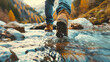 The legs of a man wearing hiking boots as he steps across a mountain stream, immersing himself in the tranquility of nature's embrace.