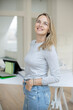 © epiximages - portrait of beautiful woman, architect, business woman in her office, loft, with grey shirt and jeans
