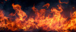 Abstract flames of fire with burning smoke floating up on black background