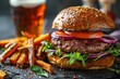 Gourmet burger with arugula, sweet potato fries and IPA beer close-up