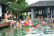 © chokniti - friendship lifestyle to happy fun in summer vacation holiday, young caucasian woman and man friend group in swimming pool water party, female person in swimwear bikini, outdoor enjoyment smiling girl