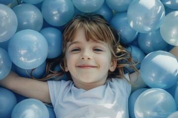 Child playing in a children's ball pit, concept of children's day and fun.