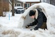 teen adding finishing touches to a snow igloo