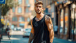 Attractive young man wearing blank empty black tank top mockup for design template in the city street