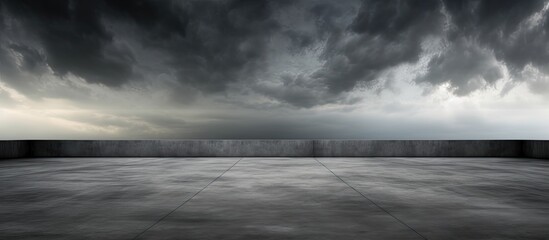 An overhead view of a smooth concrete floor contrasting against a clear blue sky backdrop