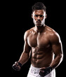 © Duncan M/peopleimages.com - Sport, fitness and portrait of man with mockup for boxing, exercise and workout isolated in black background. Body builder, athlete and boxer in studio backdrop for wellness, training and health
