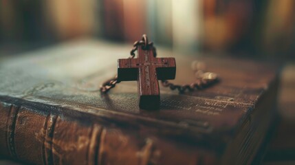 Wall Mural - Closeup of simple wooden Christian cross necklace on Bible , vintage tone , god