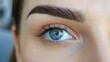 Permanent Makeup For Eyebrows. Closeup Of Beautiful Woman With Thick Brows In Beauty Salon. Beautician Doing Eyebrow Tattooing For Female Face. Beauty Procedure. will color the eyebrows. Eyebrow