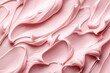 A close-up of rich, creamy moisturizer textures creating smooth waves and slashes on a soft pastel-colored background, symbolizing luxury skincare.